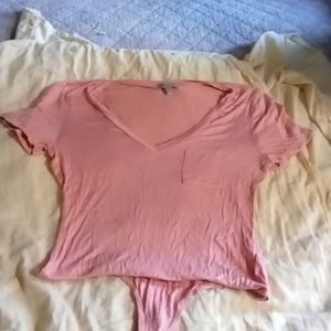 Pink bodysuit with pocket. Shirtsleeves